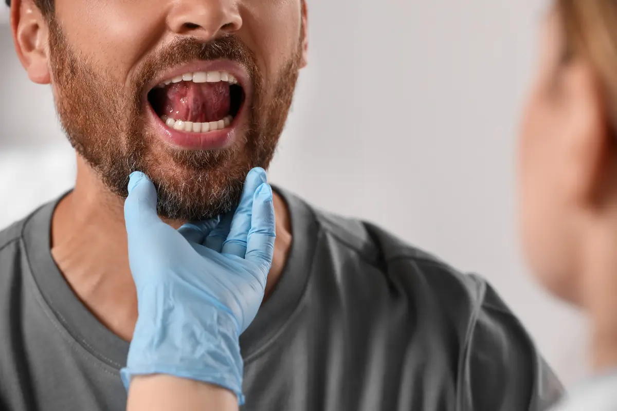 Patient undergoing an oral pathology exam by a specialist in Summerville, SC
